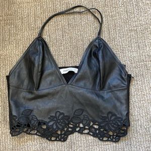 Black leather crop top.
